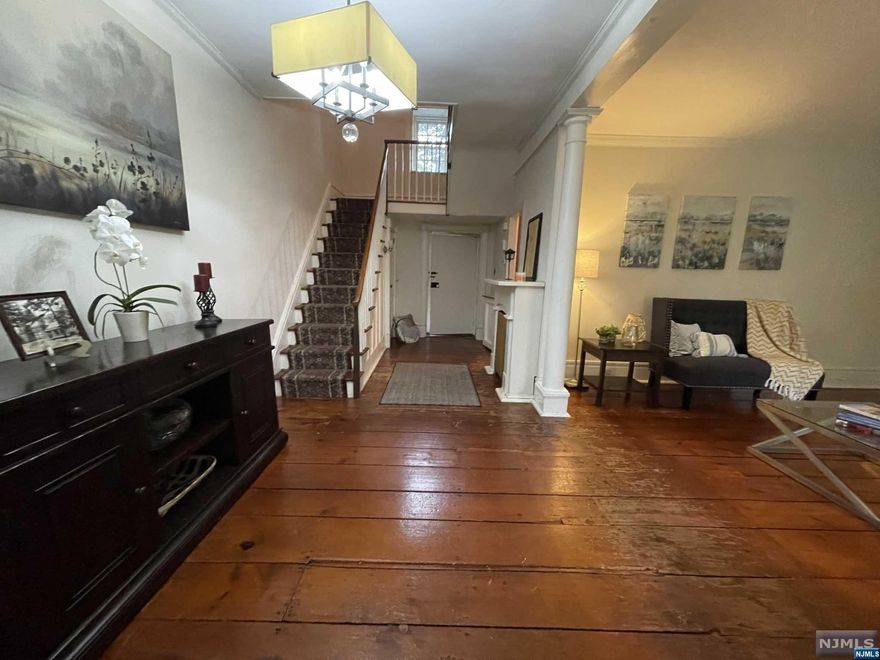 This stone Dutch Colonial Home has charm w/ 9 foot ceilings, wide pine plank floors, entry foyer, 2 fireplaces, kitchen with granite counter tops, 1st floor laundry room & 1/2 bath. Through the front door you will find a gracious side hall & stairway to the bedroom level. Upstairs you have 3 bedrooms plus an additional room that can be used as an office, play room etc. Outside you have 2 car garage plus parking for approx 10 cars. Home is on an approximate 1/2 acre, gated and includes 1 additional newer building that can be used as an office, game room, entertainment area. Contractors/developers - this property is zoned multi-family - similar zone to lot next to it that is approved for townhomes to be built. Zoning and info sent upon request ! Contact Cheryl