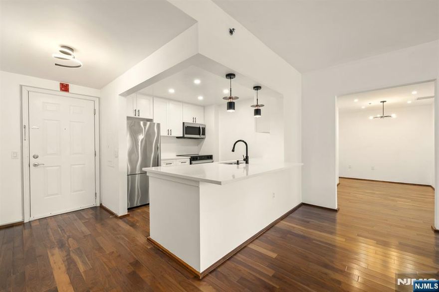 This south facing condo is conveniently located in the "3" building. It is the popular deluxe model, that has the bonus dining room. At 1,412 sq. ft. it is a nice size space at this price point. It has a Brand-New kitchen just renovated very tastefully and never used. Comes with gorgeous upgrade quality white cabinets with black hardware. Plus has stainless steel appliances, & recessed lighting, and nice size counter to fit highchairs. Large master suite, has a large walk in closet and a renovated bathroom w/new vanity, lighting. The second bathroom is also renovated and never used since. Washer / dryer in unit. Building has a beautiful lobby that is under renovation. Enjoy the convenience of shopping and great restaurants, right below, and the Hudson River front walkway. Edgewater provides free shuttle transportation to the ferry and back.