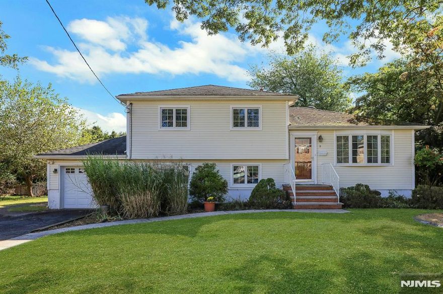 Beautifully maintained split-level on a beautiful, tree-lined street. With an easy walk to downtown shops and train station, this family home is ideally situated in a quiet neighborhood with beautiful private backyard, while being conveniently located to everything you need! Hardwood floors throughout the open main floor with a large living and dining area, an ideal flow for families and entertaining. Lower level has a large Den and additional dining area, as well as walk-out access to the backyard and patio. Upper level has 3 spacious bedrooms, all with wood floors, large windows and hanging closets, plus large bathroom. One car garage plus an additional storage shed. Backyard is partially fenced and has a great combination of sun and shade. Beautiful curb appeal to this house, must see the inside in person! Don't miss your opportunity for LOW taxes, EXCELLENT schools, AMAZING shopping and a LIVELY community!