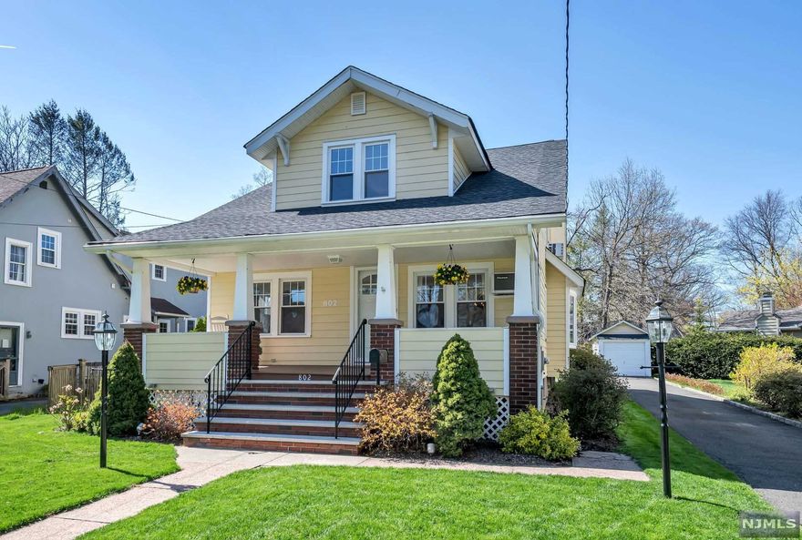 Prepare to fall in love as soon as you walk onto the lemonade porch of this beautifully updated 4 bedroom, 2.5 bathroom home. The first floor boasts an open floorplan with a sunny living room, formal dining room, updated eat-in kitchen and family room addition with vaulted ceilings, exposed wood beams and a gorgeous stone fireplace. Two generous sized bedrooms and an updated full bathroom complete the first floor. Upstairs you will find a convenient open flex space, closets galore, two additional bedrooms and a beautifully updated bathroom with soaking tub and stall shower. The finished basement with wine cellar, laundry, half bath, rec room and kitchenette make a great space for additional house guests. Enjoy the quiet backyard from the bluestone patio surrounded by perennial plantings. Great location, close to downtown, schools, parks and transportation.