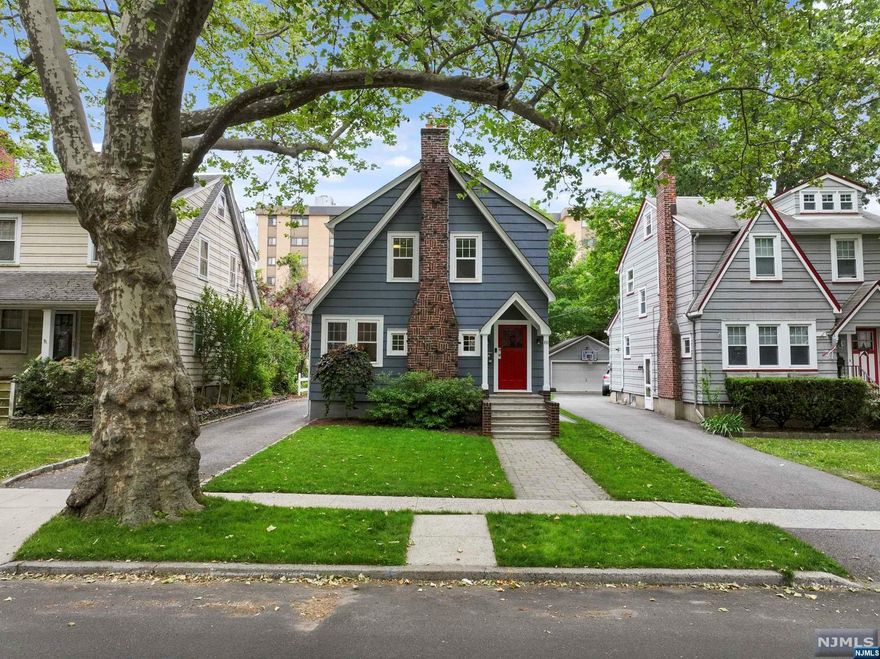 Welcome to this charming colonial-style home nestled in the Historical District of Glen Ridge. Boasting a perfect blend of timeless elegance and modern upgrades, this charming residence offers a truly captivating living experience. Upon arrival, you will immediately be drawn to the meticulous landscape displaying beautiful ornamentals and a lush green lawn. Ascend inside to experience a warm and inviting atmosphere highlighted by an abundance of natural light shining through updated windows. The main level is an entertainer's dream featuring a spacious living room adorned with gleaming hardwood floors and a clean burning remote controlled gas fireplace. The adjacent formal dining room provides an elegant setting for hosting dinner parties, while the stylish gourmet kitchen is sure to inspire your inner chef. With its custom solid wood cabinetry, granite countertops, and stainless-steel appliances; this kitchen seamlessly blends beauty and functionality.