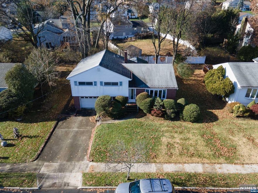 Nestled in a serene neighborhood, this lovingly well-maintained split-level home offers the perfect blend of comfort. Boasting 3 bedrooms and 2.5 bathrooms, a spacious living and dining room, the family room can be used as a game room. The extended kitchen creates a bright, spacious eat-in area leading to the deck and backyard. It's close to major highways, train station, shops & restaurants. Don't miss this opportunity to make it your home!