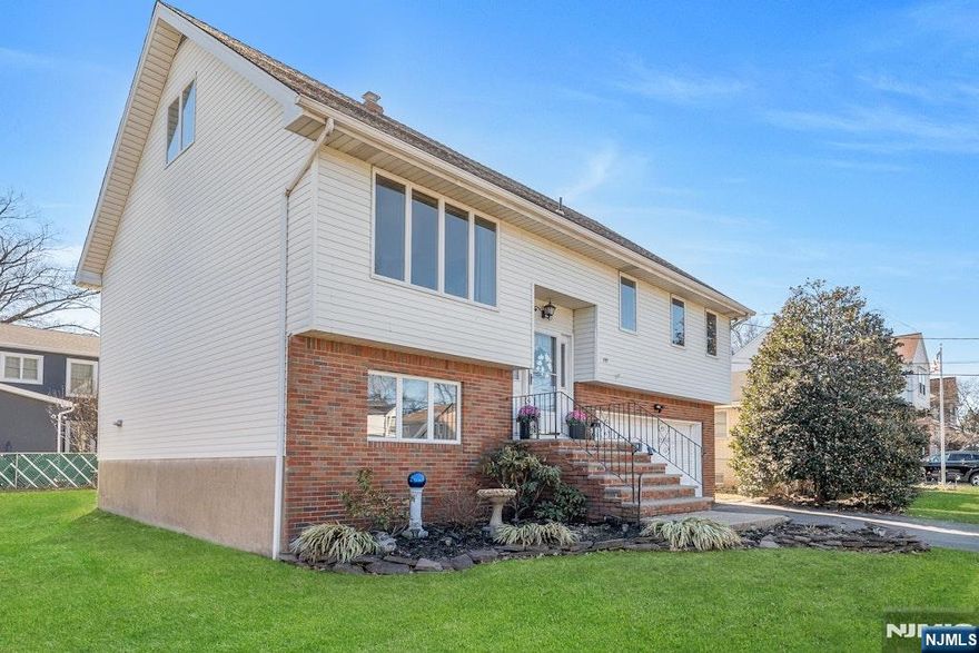 Welcome to this stunning custom bi-level home, situated in the highly sought-after Richfield section. Offering exceptional space, versatility, & comfort, this meticulously maintained property is move-in ready. Enjoy the convenience of being close to everything as sidewalks lead to schools, parks, shopping - while benefiting from a quiet residential setting. From the moment you arrive, you'll appreciate the oversized two-car garage, abundant off-street parking, & the tremendous amount of storage space this home provides. Andersen windows throughout, central air, & quality craftsmanship elevate both comfort & style. The residence features 6 generous bedrooms & 4 full bathrooms. The primary suite includes two closets & its own private bath. The first floor showcases a bright & spacious living room, a formal dining room, & a large eat-in kitchen that opens directly to the deck perfect for entertaining or relaxing above the beautifully fenced-in backyard. The ground-level suite is a major highlight, offering a full bedroom and bath, and a layout ideal for guests. Additional upgrades include a brand-new washer and dryer, newer central air, & three zones of efficient baseboard heat. This exceptional home combines size, flexibility, and premium features in one of Clifton's most desirable neighborhoods.