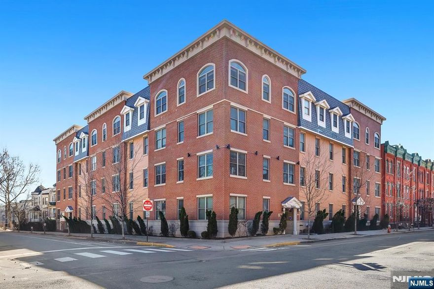 Modern duplex unit with parking and skyline rooftop in the vibrant section of The Heights in Jersey City, this sun-drenched duplex residence offers a perfect blend of space, light, and modern comfort. Oversized windows fill the home with natural light, creating an inviting and airy atmosphere throughout. The main level features an elegant open-concept living and dining area seamlessly connected to a stylish kitchen with a sleek quartz breakfast bar, ideal for entertaining or casual dining. Rich hardwood floors flow throughout the home, complemented by central HVAC with a Nest thermostat for effortless climate control. A full bathroom completes this level. The lower level offers two spacious bedrooms, a second full bathroom, and a convenient laundry and storage area, providing both comfort and practicality. Located just steps from Central Avenue and Journal Square, residents enjoy easy access to a dynamic mix of boutique shops, cafes, restaurants, and convenient transportation options to Manhattan. The building enhances the lifestyle experience with premium amenities, including a fully equipped fitness center and an impressive rooftop terrace showcasing breathtaking panoramic views of New York City Skyline.