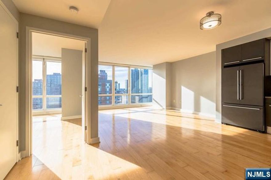 ***THOMAS MCCARTHY (201-206-8144) & The Chen Agency*** present: This beautiful Luxury High Rise building Towers high over the Hudson River boasting views which are nothing short of Spectacular. Floor-to-Ceiling windows line the Exterior naturally inviting a warm splash of sunlight inside. This 1 bedroom, 1 bathroom home is a breath of fresh air featuring a state-of-the-art Kitchen, Spacious bathroom, Hardwood Flooring throughout, and approximately 800 square feet of living space!! This is a deal that's not to be missed! One Valet parking space, cooking gas, and heating are all included in the rent. Close distance to the Path, Light Rail, Ferry, and fabulous Shopping. DUE AT LEASE SIGNING: 1st month's rent, 1.5 month's security. There is also a $250 building application fee, $500 move-in fee, and a refundable $500 moving day deposit. Contact Tom 201-206-8144 for all showings.