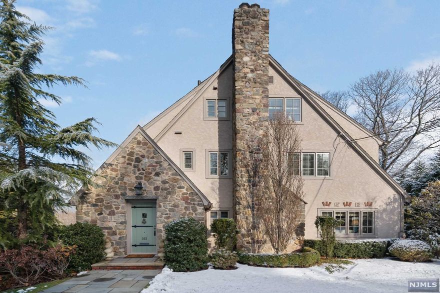 STUNNING COMPLETELY RENOVATED TUDOR NESTLED IN THE HEIGHTS NEIGHBORHOOD OF RIDGEWOOD- JUST MINUTES TO NYC TRAINS,SCHOOLS,SHOPS & RESTAURANTS! THIS SOPHISTICATED, WELL APPOINTED HOME HAS HRDWOOD FLRS,NEW WINDOWS/DOORS, ELEVATOR & IMPRESSIVE MILLWORK THROUGHOUT. GOURMET KITCHEN W/ CUSTOM RUTT CABINETS, QUARTZ COUNTERS & HIGH END APPLIANCES. LR W/ GAS FIREPLCE, DR W/ FRENCH DRS TO BLUESTONE PATIO. DETAILS ABOUND IN THIS HOME W/ BEAUTIFUL BUILTINS, MOLDINGS & ACCENTED MARBLE FLRING. FR W/ BEAUTIFUL WINDOWS & FRENCH DRS TO IPE DECK OVERLOOKING THE MANICURED GARDENS. 2 STORY WINDOWS W/ CURVED STAIRCASE HIGHLIGHTS THE AMAZING VIEWS FROM THIS HOME. THE 2ND FLOOR HAS FULL HALL BTH, BDRM W/ ENSUITE BTH & BDRM W/ CUSTOM BUILTINS. THE MBR W/ PECKY CYPRESS CEILING, ENSUITE BATH AND 2 WALK IN CLOSETS IS A DREAM. 3RD FLOOR W/ FULL HALL BTH AND 2 ADDITIONAL BDRMS. THE GRND FLR HAS CHECKERBOARD MARBLE TILE, FRENCH DRS TO PATIO, ACCESS TO 3+ CAR GARAGE, LNDRY RM W/ FARMHOUSE SINK & STORAGE GALORE.