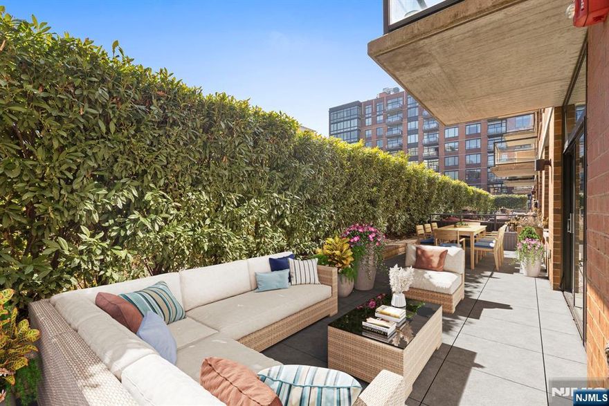 **OH - Sat (3/14) 12pm - 2pm** Incredible two bed, two bath home with attached private patio in the luxury community of 1100 Maxwell Ln! Open floorplan and East-facing floor-to-ceiling windows mean the home is soaked in sun. Chef's kitchen features quartz countertops, stainless steel appliances and custom cabinets. Primary bedroom features a walk-in closet and luxurious ensuite bath. The spacious secondary bedroom with its own walk-in closet and the additional bathroom round out this perfect home. Also included is central A/C, in-unit washer/dryer, gleaming hardwood floors, and deeded parking spot #40. The communityâ€™s generous amenities include 24/7 concierge and security, 2 gyms, 2 pools, 2 playrooms, 2 rooftop decks with BBQ grills, community rooms, and shuttle service to and from the Path. The building is conveniently located near the NYC Ferry, bus stop, shops, restaurants, and everything that uptown Hoboken has to offer.