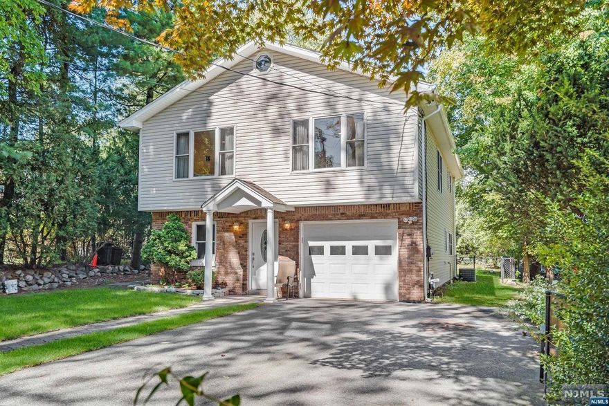 Home-sweet-home in beautiful Franklin Lakes! This exquisitely maintained Raised Ranch boasts 4 bedrooms, 2 full baths, gleaming hardwood floors, an updated kitchen, an ideal location on a quiet street, & very low taxes. A short stroll to the town library, park & all that Franklin Lakes has to offer. You are welcomed into the home by a large entry foyer with plenty of room to kick off your shoes, hang your coats & keep things organized. Upstairs you enter into the spacious living room, dining room & kitchen. The open concept design allows for wonderful entertaining opportunities! The beautifully updated kitchen includes a large center island, granite counters & stainless steel appliances. 3 Bedrooms & a full bath complete the main floor. On the lower level, you will be thrilled by the huge family room with sliders to the backyard patio. There is a convenient 4th bedroom & full bath on this floor, along with the laundry area & garage entry. Nothing to do here but unpack!