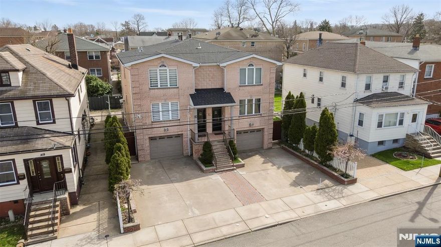 Exceptional side-by-side two-family in Fairview offering 4 bedrooms and 3.5 bathrooms per unit across three finished levels of living space. Each unit features an open kitchen flowing to a private balcony overlooking the backyard, hardwood floors throughout, and generous closet space on every level. The primary suite includes a private en-suite bath, soaring high ceilings, and double closets. The finished ground level adds a summer kitchen with direct backyard access, perfect for entertaining. A rare opportunity to own a modern, well-appointed multi-family with the space and finishes of a single-family home.