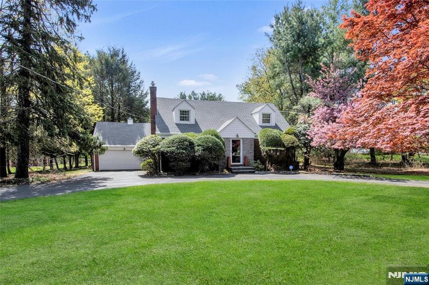 Welcome to this Wonderful Four Bedroom Nantucket Colonial set back from the Road on a circular driveway set on an extraordinary 150 x 392 flat & remarkable property (58,806 square feet), with an updated Kitchen (stainless and granite & Breakfast bar) with a wall of glass overlooking the exceptional & private property. Two updated Baths, Large Living Room/Fireplace, 2 spacious Bedrooms Main Level, 2 Large Bedrooms, Home Office & Bath on Upper Level. Immense lower level with Recreation Room (outside access), Summer Kitchen (stove to be removed), 2 car attached garage . Roof approx. 2 years, leaf guard gutters, Gas Furnace 2008, HWH 2 years, Central Air Conditioning, Vinyl & brick exterior. The property goes all the way back to the fence at the rear.. Love this home it as it is, Renovate & Expand, or Build the House of your dreams on this gorgeous property. The choice is yours! This home is being sold in "as is" condition, although lovingly maintained by its owners."