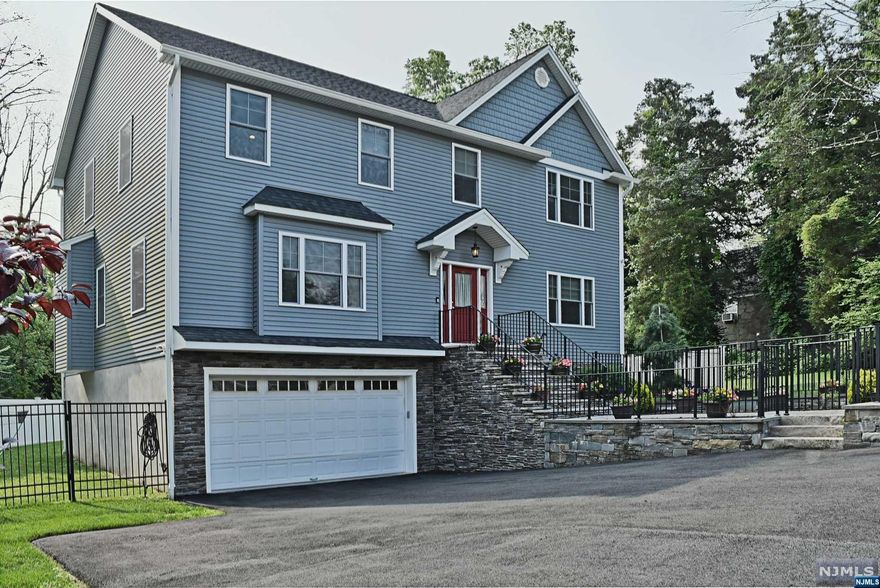 Recently Built 4 Bedroom, 2 1/2 Bath on a quite dead end street with a desired open floor plane. Recessed LED Lighting throughout, 10' Ceilings on the First floor, Crown Moldings, Oak Floors Throughout the House, Kitchen and Baths - Quartz Countertops. Full House Generac Generator, 2 Zone AC / Heat, Public Utilities. Covered Deck, Fenced Yard, Extra Large Attached 2 car Garage with Custom Storage. Custom fitted Closets Throughout. Also included Dining Room Chandelier, Refrigerator in Basement, Wine Refrigerator in Basement. Located on a Quite Dead End Street near Center of Town, Close to all Major Highways, Stores and Transportation.