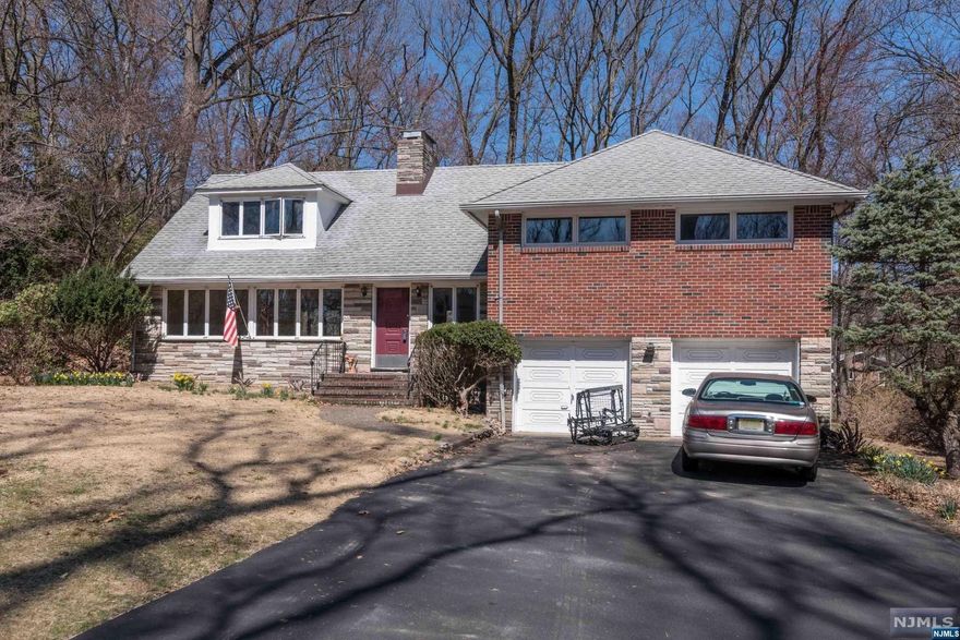 Looking for a home in USR.. top rated schools, proximity to RT 17, NY Thruway and GSP, then don't miss making this house your home. Surrounded by multi-million dollar homes, this brick and stone exterior has two car garage, oversized LR with 8 casement windows, DR, hardwood floors as in, EIK with separate refrigerator and freezer. Entrance opens into a FR with custom brick fireplace. Three bedrooms and full bath are a few steps up and an oversized unfinished room with rough plumbing can be converted to a primary suite on the third floor. Mud room, full bath, laundry lead to the two car garage and backyard. Unfinished basement w fireplace complete the lower level. A "Diamond in the rough", not to be missed. Original owner who had this house custom built. House is sold "as is".