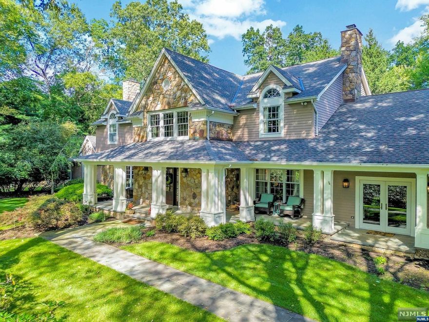 Nestled on 2.7 acres of mature grounds, at the end of a private cul-de-sac, adjacent to a nursery, this tranquil Saddle River Estate with 3 Stall Barn/Carriage House exudes a charm and subtle elegance that is one of a kind! A welcoming covered stone front porch invites you to step into the 2 story foyer with curved staircase. On the left is a formal dining room with fireplace, and French doors leading to a lounge and primary suite. To the right the cosy living room features a stone fireplace, the perfect spot to relax after a long day, and a private study which opens to porch. There's a traditional kitchen with terracotta floor, 2 islands, a terrific space to prep for Thanksgiving or The Holidays, and large breakfast area, with doors leading to the outdoor patio/entertaining and pool. A "junior suite" plus 3 bedrooms and hall bath on 2nd floor. Large mud/hallway, 3 car garage w/stair to loft, 2 laundrys. Approx 6083sq sf on 1st/2nd floors w/additional partially finished basement!