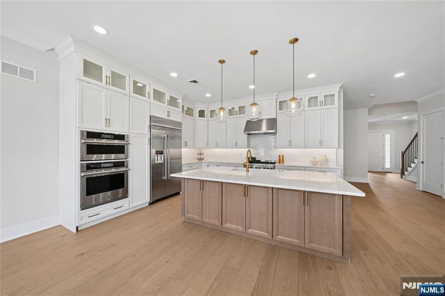 FINAL HOME SITES AVAILABLE! The Elgin's welcoming covered porch and stunning two-story foyer reveal the spacious great room and casual dining area, with views to the desirable large patio beyond. The well-equipped gourmet kitchen is highlighted by a large center island with breakfast bar, plenty of counter and cabinet space, and roomy walk-in pantry. This home's kitchen offers features others dream of including Quartzite countertops and slab backsplash, stacked cabinetry highlighting the 10' ceiling height, double ovens, a built-in refrigerator (to be installed), and an expanded island. The elegant primary bedroom suite is enhanced by dual walk-in closets and deluxe primary bath with dual-sink vanity, large soaking tub, luxe shower with seat, linen storage, and private water closet. Central to a generous loft, secondary bedrooms feature walk-in closets and shared hall bath. The finished basement includes a full bathroom and plenty of storage space. Enjoy sunset BBQs on your west-facing patio with gas line for a grill.