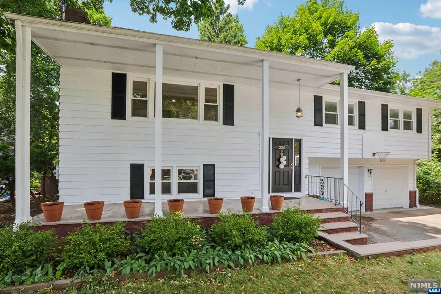 Welcome to your tranquil retreat nestled in one of Ridgewood's most convenient locations! The idyllic Brookside Ave cul-de-sac offers close proximity to schools, town & transportation, all while transporting you to a nature-lover's paradise the moment you step inside. The contemporary style connects indoors & outdoors with walls of windows and sliding doors to recreation areas. This stunning home features a light-filled, open concept design for modern living. The Gourmet Kitchen boasts brand new stainless steel appliances, & flows to the Dining Room and Living Room. Generously sized bedrooms, 3 Full Bathrooms and a walk-out Lower Level offers extended family living possibilities. The sunny lower level offers a Family Room, Bedroom and Office, along with the convenience of an oversized, finished two-car garage. After relaxing indoors, step into an outdoor sanctuary with a handcrafted outdoor model train set, stairs leading down to a level play area and access to Dunham Trail.