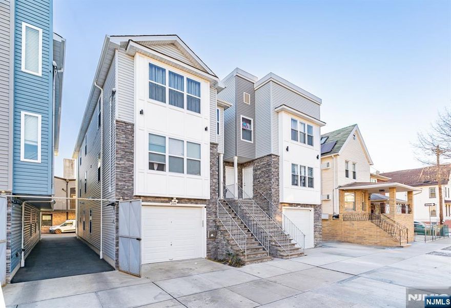 NEWLY BUILT, UNIQUE two-family featuring a rare ground-level unit with 2 rooms and a full bath, home office, or added flexibility. The definition of turnkey, located in North Newark, bordering Bloomfield and Belleville. Built by an experienced builder with no expense spared, showcasing quality craftsmanship, modern finishes, and thoughtful design throughout. ideal for Owner-occupants or investors seeking low maintenance, strong rental appeal, and long-term value in a high-demand location close to major transportation, shopping, and dining. come turn this house into a home before someone else does!