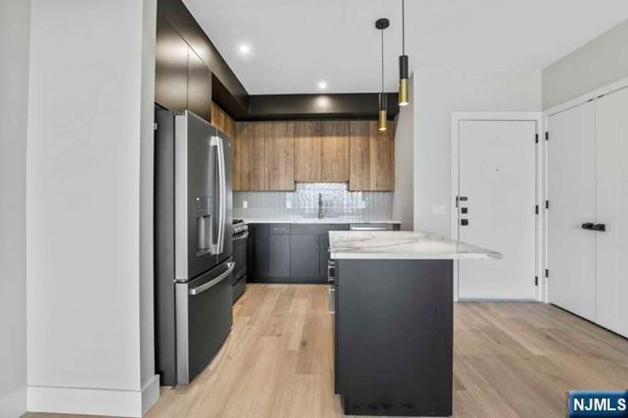 *MOVE-IN PROMOTION: ONE MONTH FREE ON 13 MONTH LEASE!* Welcome to LADDERMAN VIEWS! A boutique, 1-year young elevator building located near Fort Lee's Main Street & The George Washington Bridge. Unit 203 features 2 bedrooms, 2 full bathroom & in-unit laundry. 1,236 square feet of space equipped with high-end finishes, heated primary bathroom floors, modern two-tone cabinets, quartz kitchen island + countertops and Andersen windows. Other features include: Virtual Door Assistance, covered parking, elevator & dedicated mail & trash rooms. Conveniently located near all Fort Lee has to offer - parks, shopping, restaurants & transportation. Available immediately!