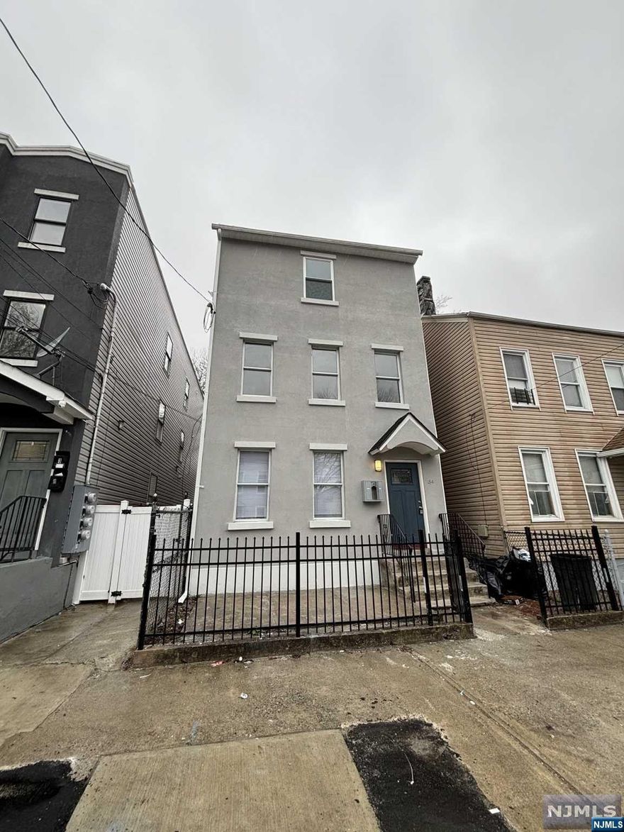 Totally renovated MOVE IN READY large 2 family house with finished attic. Home was expanded into a legal 2 family house.3 bedroom on each floor. 3 full baths. Separate entrance. Heating in attic is electric. All new windows, roof, siding. All separate utilities.