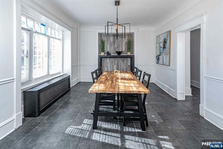 Situated across from the historic Cadwalader Park, designed by renowned architect Frederick Law Olmsted, this home is steeped in charm and history while featuring updates throughout. Step into the welcoming foyer, where you'll find a spacious living room with a wood-burning fireplace that flows into an enclosed sun porch, perfect for relaxing year-round. A formal dining room connects to the updated kitchen. The first floor also includes a full bathroom for added convenience and there is another half bath in the versatile basement. On the 2nd floor, the large main bedroom features a dressing or sitting area and ample closet space, accompanied by three additional bedrooms and a renovated full bath. The third floor offers a fifth bedroom and another full bath. This beautifully renovated center-hall colonial in Cadwalader Heights blends timeless design with modern upgrades, offering a unique opportunity for both homeowners and investors. Virtual Tour: https://njproper.com/mls-10-whittier