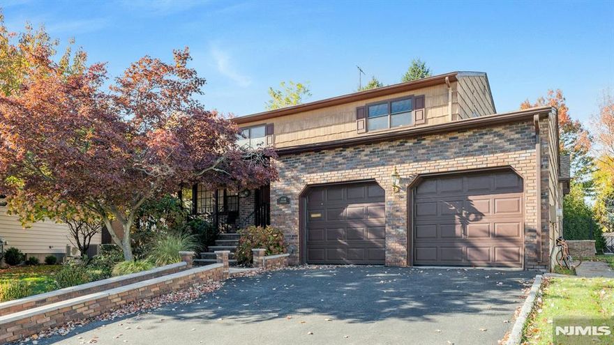 Nestled on a serene cul-de-sac in one of Fair Lawnâ€™s most desirable areas, this exceptional center hall colonial offers a wonderful flow and generous living spaces. The double-entry foyer leads to an expansive living room w/recessed lighting and hardwood flooring and a spacious formal dining room provides the ideal setting for special gatherings. The heart of the home is a stunning European-inspired kitchen blending modern elegance with thoughtful design. This bespoke kitchen showcases the premium craftsmanship of Neff and Pedini cabinetry featuring clean lines, sleek finishes and a beautiful island w/seating. Truly the epitome of functionality and style, with dual sinks, dishwashers & ovens, a complementary banquette dining nook, radiant heated flooring and sliders leading to a 40-foot deck! The main floor is complete with a gracious powder room and family room that exudes warmth and comfort with custom millwork and a fireplace. Upstairs you will find 4 generous bedrooms including a primary w/ensuite bathroom--each bedroom offering ample closet space and hardwood flooring beneath the carpet. The finished basement offers a large rec room, abundant storage, 2 flex rooms for office, guest space or home gym, and a Jack and Jill half bath. Convenient main level access to the 2-car garage. Enjoy your quiet, private outdoor space from either the front porch or rear deck. With its harmonious blend of comfort and convenience, this home is a rare find in an unmatched location.