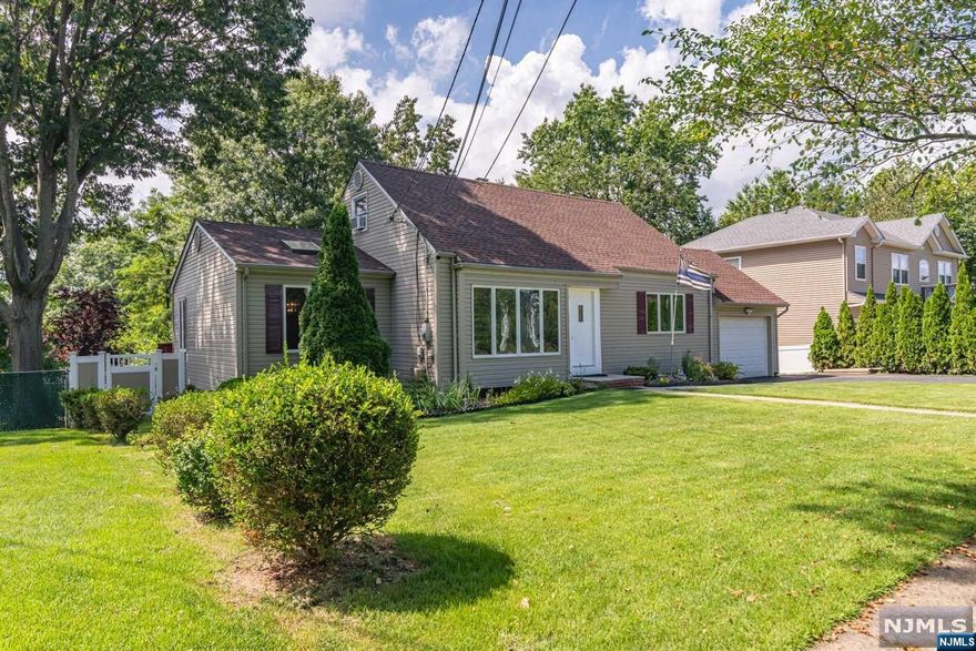 Welcome to this charming cape, thoughtfully designed and offering a blend of comfort and functionality. With a four car driveway and a garage, parking is never a hassle. The main level boasts an inviting living room, adjacent you'll find a naturally lit dining space adorned with skylights. French doors off the dining area create a seamless connection between indoor and outdoor living spaces. A chef's dream kitchen offers an abundance of cabinets. The two bedrooms and full primary bathroom on this floor offer versatility, convenience, and comfort. Venture to the second floor to be greeted by two bedrooms that offer privacy and relaxation. A second full bathroom adds convenience. The basement offers more living space and utility, with a family room/theater, a large office, recreational space ideal for a play area or bar, and a large utility room for laundry and plenty of storage space.