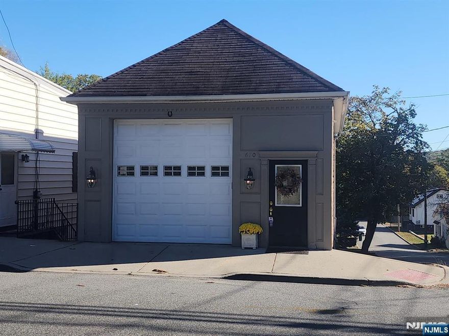 Versatile commercial garage with office and half bath. Excellent location with high visibility and easy access. Offering convenience and functionality for a variety of businesses. Ample parking accommodates employees or customers. Ideal for contractors, trades, storage, or other commercial uses. A flexible space ready to fit your needs.