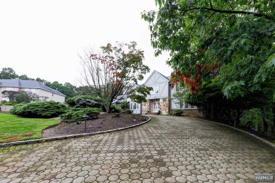 STUNNING 5 BEDROOM TUDOR WITH LARGE ROOMS, GRAND STAIRCASE, IN-GROUND POOL, A MUST-SEE! MAIN FLOOR HOLDS DINING ROOM AND FORMAL LIVING ROOM WITH BEAUTIFUL MAHOGNY FLOORS, FAMILY ROOM, FULL BATH, POWDER ROOM, BEDROOM/OFFICE, KITCHEN AND LAUNDRY. TAKE THE GRAND STAIRCASE TO THE SECOND LEVEL WHERE YOU WILL FIND THE PRIMARY BEDROOM/BATH SUITE WITH 2 WALK-IN CLOSETS, A SITTING ROOM, JACUZZI TUB, STALL SHOWER AND MORE! 3 ADDITONAL LARGE BEDROOMS AND A FULL BATH WITH LAUNDRY COMPLETE THE FLOOR. BASEMENT IS FULL AND FINISHED WITH REC ROOM/LR, 3 BEDROOMS, FULL BATH, UTILITY ROOM, STORAGE AND A PRIVATE ENTRANCE WALK OUT.