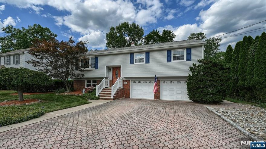 Nestled on a beautiful tree-lined street that radiates pride of ownership, this meticulously maintained Bi-Level home offers 3 bedrooms with the option for a 4th, 2.1 baths, and a 2-car garage. The main level boasts a sun-filled living room with bay window, a spacious dining room, and an updated kitchen with stainless steel appliances and quartz countertops. The primary suite features two closets and a private en-suite bath, complemented by two additional bedrooms and a full main bath. The ground level provides versatile living with a home office, a rec room with access to a covered patio, flexible space perfect for a 4th bedroom, laundry room, powder room, and garage access. The exterior is equally impressive with a manicured garden, tiered Trex deck, above-ground pool, and fully fenced yardâ€”perfect for relaxing, entertaining, or play. Roof and skylights 2017, major systems 2011 see detailed listed at property. Located near community parks, shopping, major highways, and top-rated schools, this move-in ready home truly has it all.