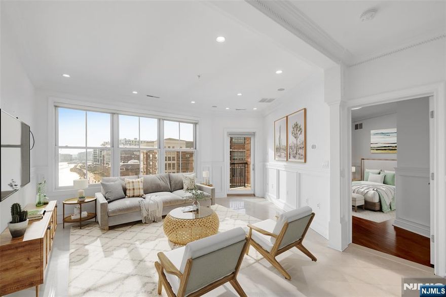 World-class living awaits you in this stunning 2 Bedroom + Den / 2 Bathroom luxury home located in highly sought after Grandview I. Situated along the banks of the Hudson River and just steps from restaurants & shopping, this home features only the finest finishes. Stretching across 1,328 SqFt, this sun drenched home features direct South and East views of NYC and the Hudson River, gleaming floors, custom window treatments, custom molding and woodwork, one car garage parking, in-unit laundry, and balcony with stunning views. This corner unit floor plan includes entry foyer, living room / dining room combo, Chef's kitchen, two spacious bedrooms, renovated bathrooms, and bonus den / office. Chef's kitchen includes granite countertops, custom cabinets, SS appliances, and breakfast bar. Master bedroom features custom walk-in closet and renovated ensuite bathroom with dual vanity and linen closet. Grandview I includes 24 hour concierge, fitness center, resident lounge, outdoor pool with NYC views, and a pilot tax abatement program. Located next to ample shopping, restaurants, public transportation, and the waterfront walkway, this home is sure to please!