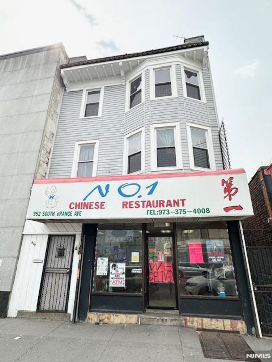 Three-story mixed-use offering 3 units comprised of two 3-Bed apartments anchored by one neighborhood retail storefront. Located on upper levels, each elongated-shaped apartment with wood flooring and storm windows features dedicated living room space, eat-in kitchen, one centralized full bath and front/middle beds respectively. The commercial leasehold w/ 9 ft ceiling height currently operating under restaurant use contains an in-place ventilation system affording hot kitchen use & sole access to stand-up unfinished basement as well as fenced-in courtyard w/ gated exterior side egress ideal for loading purposes. Utility infrastructure offers separately metered electric & heat/hot water fueled by gas for all units while the commercial tenant assumes full responsibility of cold water/public sewer expense for the entire building. Convenient Upper Vailsburg geography offers immediate access to NJ Transit public bus transportation/local shopping and high walkability to South Orange-based Seton Hall University. New ownership positioned to benefit from return-on-investment upside thru vacant apartment lease-up at market rate plus 3.0% annual rent escalations from commercial tenant and rent improvement in one unit currently -28% below the immediate areaâ€™s median market rent of $2,350 for 3-Bed unit type. Investment opportunity ideal for owner/user thru vacant apartment occupancy or small Core Plus investors open to minor property enhancements and minimal management responsibilitie