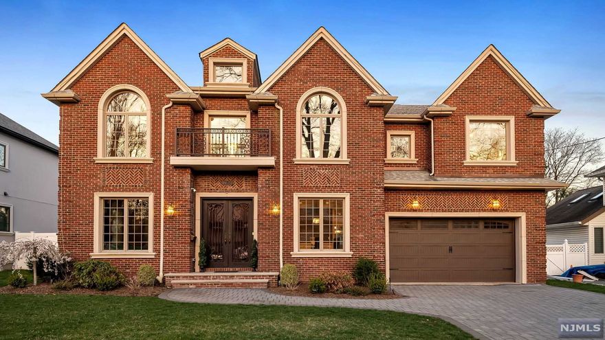 Welcome to this 6 bedroom, 5 full and 1 half bath center hall colonial with over 6,000 sq ft of living space and the highest quality finishes and craftsmanship throughout. Enter through the 2-story foyer with marble flooring to find formal living and dining rooms, a bedroom with ensuite full bath, and a sunlit, beautiful 2-story great room with gas fireplace, coffered ceilings and floor-to-ceiling windows. The gourmet Chef's eat-in kitchen is complete with center island, stainless steel appliances, butler's pantry, as well as sliding glass doors to the paved patio and the meticulously manicured fenced-in backyard with a hot tub. Mud room off the kitchen has access to attached 2-car garage. The primary suite with a luxurious full bath and 2 walk-in closets, a bedroom suite, 2 additional bedrooms, a full bath, and a laundry room complete the second level. The full, finished lower level is perfect for entertaining with a bedroom, full bath, theater, gym, and large recreation area.