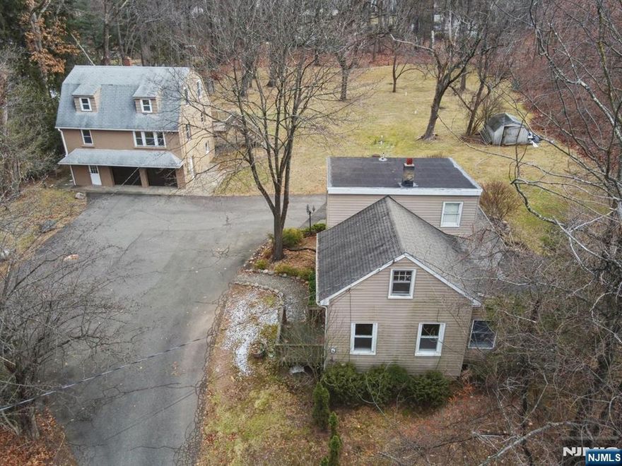 Donâ€™t miss this rare chance to own a unique property featuring two single-family homes on one parcel in desirable Franklin Lakes. The front home includes 3+ bedrooms and 1 bath, while the recently updated back home boasts 4 bedrooms and 2.5 baths. Situated on an oversized lot, the possibilities are endlessâ€”generate rental income, redevelop, or create a multi-generational living setup. This versatile property is a true gem!