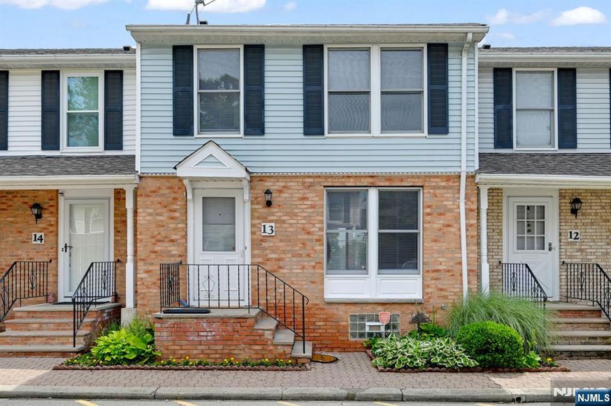 Welcome to this beautifully upgraded 2-bedroom, 2.5-bath townhome located on a quiet street in a peaceful neighborhood. Step inside to a bright, open main level featuring luxury vinyl plank (LVP) flooring, a spacious living room, and a formal dining area. The modern kitchen is equipped with brand NEW STAINLESS STEEL Appliances, making meal prep a delight. A convenient powder room is also located on the main level. Sliding doors open from the dining area to a private deck. Upstairs, you'll find plush NEW CARPETING and two ensuite bedrooms. The primary suite features a walk-in closet and a private bath, providing a true retreat. The fully finished basement offers additional living space w/ Rec room, a dedicated laundry area with washer and dryer, and storage. Recent updates include a Brand-NEW Water Heater for added efficiency and peace of mind. Throughout the home, stylish Decora switches add a sleek, modern touch. Enjoy the convenience of two assigned parking spaces. Commuters will love being just 4 minutes from the Orange train station, offering direct service to NY Penn Station in 30 minutes. Experience a vibrant community with easy access to Monte Irvin Orange Park, South Mountain Reservation, Turtle Back Zoo, local dining, shops, and historic landmarks. Move-in ready and waiting for you. Don't miss this exceptional opportunity in a prime location