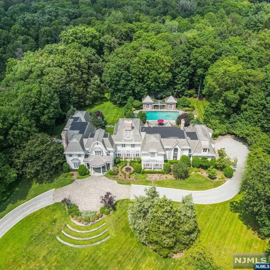 This 4 acre country estate is in the heart of Saddle River on desirable Alford Drive. This stunning home boasts 6 bedrooms and 8 baths, has 12-14 ft. ceilings throughout, and a grand two-story entrance with a view of the pond through the floor to ceiling windows. The charm of yesteryear is evident throughout the entire home, with details such as a slate roof, a wood paneled library, exquisite windows and beams. The over-sized gourmet kitchen is a chef's dream, complete with a sitting area and an eat-in area all overlooking the breathtaking view of the gunite pool, cabana, and elaborate landscaping. The two-story conservatory is a highlight of the home, allowing for an abundance of natural light..The first floor primary suite provides a private retreat for the homeowners. Additionally, there is a home theater, a temperature controlled wine cellar and tasting area and a professional gym. For a private showing call/text Lauren Kairys Schachtel 201-509-0402 or Mike Randy 201-218-5850