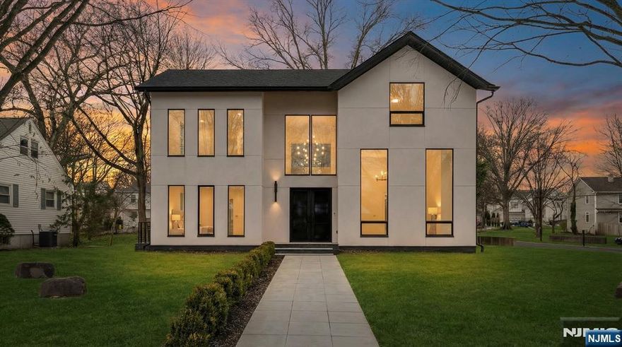 Architectural Masterpiece in the Heart of Paramus! This stunning brand-new construction, designed by Builtd Architecture and built by Solid Base Construction, offers 6 bedrooms, 6.5 bathrooms, and nearly 6,600 sq ft of luxurious living space across all levels. The main floor features 9.5-ftceilings and soaring 13.5-ft ceilings at the spacious living room, a welcoming foyer, guest suite with full bath, and a chefâ€™s custom kitchen with Thermador appliances, Dekton countertops, and Blum hardware that flows seamlessly into the dining and family rooms. The finished basement includes a sauna, gym, and home theater. Upstairs, the primary suite boasts a spa-like bath with floor-to-ceiling Dekton panels and Riobel fixtures. All other bathrooms are furnished with Italian porcelain tiles, and Hansgrohe fixtures. A private junior suite with WIC and full bath crowns the top floor. Additional features include oversized thermally broken aluminum windows with fully tempered low-E glass, full climate control with humidity management, underground electrical service, and an emergency generator. Many more high-end features and finishes.