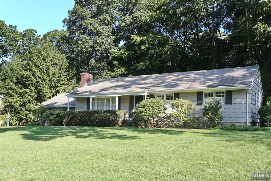 Located in a premier interior neighborhood, in one of Bergen County's most coveted towns, this classic Wyckoff ranch sits on almost 3/4 of an acre of private wooded property and offers great value that will appeal to today's most discerning buyer. This special home offers a total of 3 bedrooms and 2 full baths, both formal living and dining rooms, kitchen, and cozy family room. A quaint 3-season porch overlooks the private wooded property. The basement is huge and can easily be finished for additional living space. Additional value items include original hardwood floors (covered by carpet for almost 70 years!), 2 fireplaces, central air, attached two-car garage, and public sewer and water. Wyckoff is well known for its' award-winning school system, exceptional recreation programs and facilities, a wide variety of great shopping and restaurants, and acres of dedicated Greenspace. Make some cosmetic changes, renovate, or expand...the choice is yours and the options are limitless!