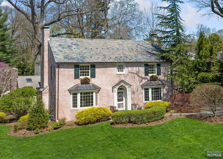 'Father of the Bride' home situated on gorgeous flat custom landscaped yard with beautiful gardens. This Peterson built center hall colonial with attached 2 car garage features front to back LR w/ fire place, banquet size DR, 1st floor office w/ fire place, & powder room. Jim Kershaw MEIK opens to step down family room w/ fireplace, wet bar and french doors leading to patio w/ custom outdoor Kitchen. The 2nd floor has 5 bedrooms including a primary bedroom suite w/ full bath, 3 additional bedrooms, full hall bath plus, bonus bedroom with ensuite bathroom. Located on the 3rd floor is a bedroom, full bath and storage room. The lower level has rec room w/ fireplace, sports room, laundry and half bath. A unique opportunity to live minutes to schools, shops & restaurants!