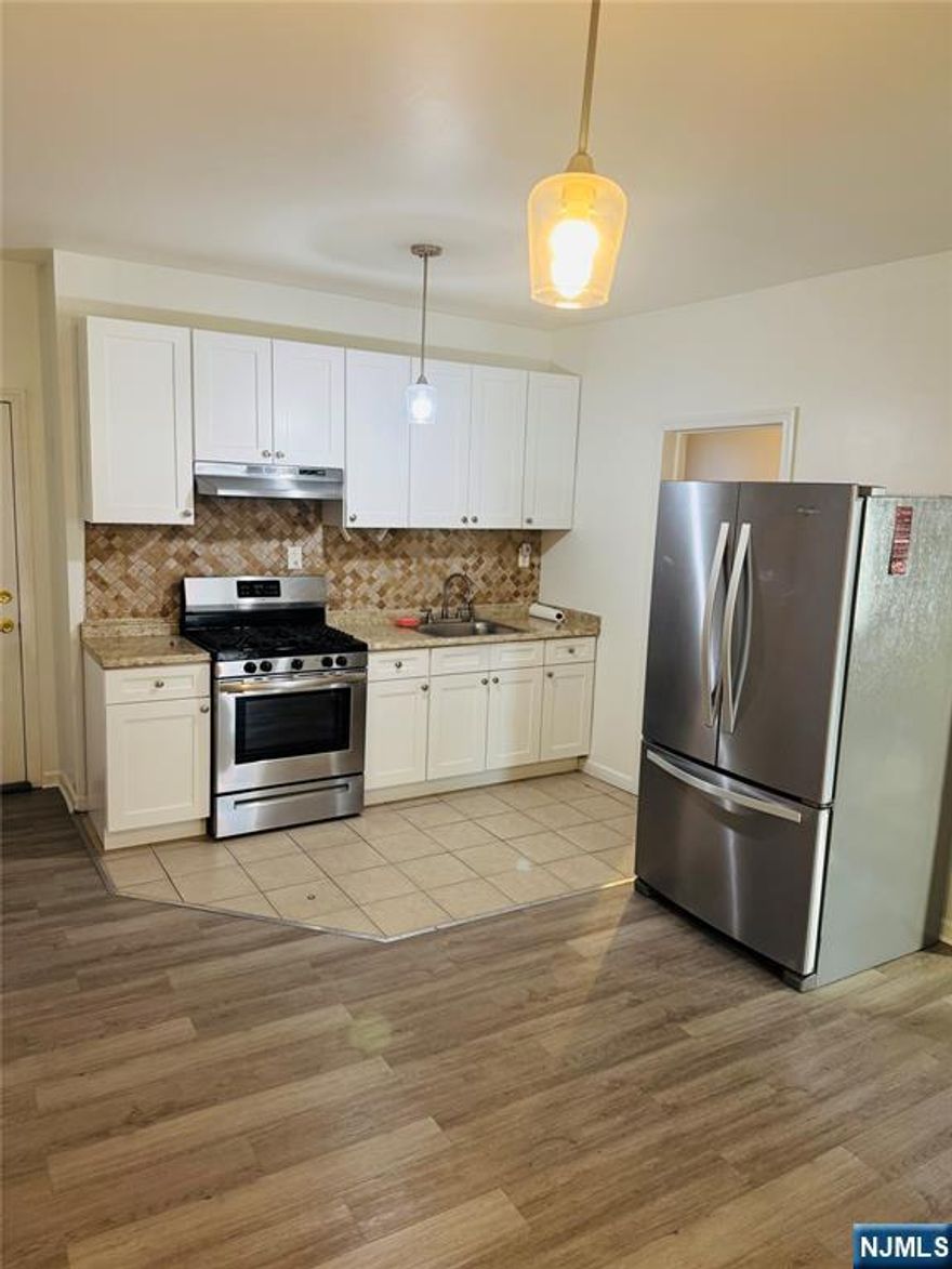 This newly renovated two-bedroom apartment showcases clean, modern design throughout. Highlights include upgraded flooring, a contemporary kitchen with updated cabinetry and appliances, and a renovated bathroom with modern fixtures. The thoughtfully designed layout offers two generous bedrooms and a bright, open living area.