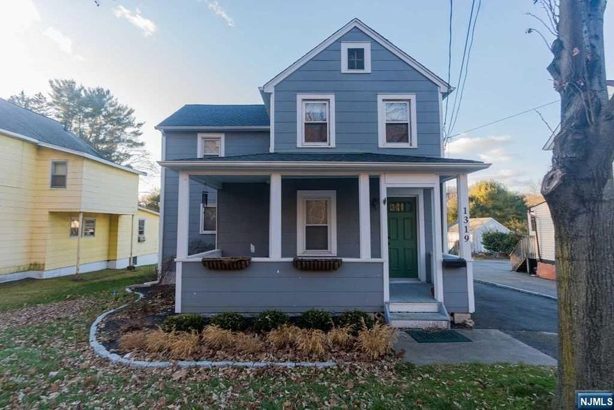 Welcome Home! Come see this charming 3 bedroom colonial. The kitchen and bathroom have been remodeled. The kitchen features new appliances. There is a spacious detached two car garage and plenty of space in the driveway. New deck off the mudroom and new windows throughout the house. This space also has the original 1912 hardwood floors.