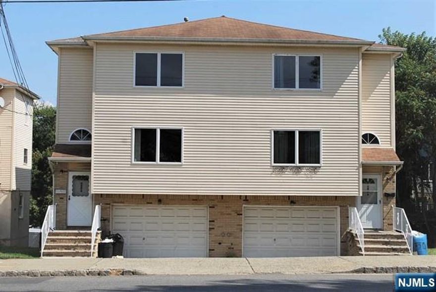 Easy Commute to NYC! Tons of space. Newly updated extra large duplex featuring a primary suite, 4 bedrooms, 2.5 baths, living room, large eat-in kitchen, and bonus room. Enjoy deck and backyard access, garage parking, and a full basement for storage or recreation. A beautiful pear tree adds charm and seasonal enjoyment. With multiple levels that live like a true single-family home, this property offers space, comfort, and convenience â€” all just minutes from NYC transit, shopping, and dining!