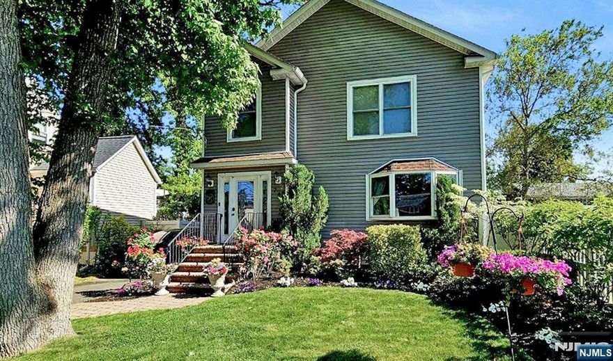 *Please note - the taxes listed on some third-party websites are inaccurate. 2025 Taxes were 15,631 Welcome home to this incredibly maintained center hall colonial! Enter the home through the spacious foyer and into the large hallway. Relax in the large living room with picturesque bay window overlooking the beautiful garden. Enjoy family meals in the dining room situated right off of the kitchen. The first floor is complete with a large bedroom, full bathroom, laundry room, and spacious closets throughout! Walk upstairs to the second floor to find the primary bedroom with an oversized dressing room that would also be perfect as a nursery or office! Two additional bedrooms and a large full bathroom with clawfoot soaking tub and oversized shower complete the second floor. The basement is an entertainers dream come true with large open concept recreation area complete with a wet bar and kitchenette! Enjoy quiet nights in the backyard on the beautiful patio. Detached single car garage and extra-long driveway including an EV charger complete this property. ***HOMEOWNER IS REAL ESTATE AGENT***