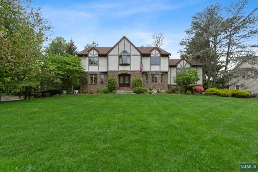 Elegant 5 BR, 3 Full Bath, 2 Half Bath center hall colonial in Wyckoff's desirable Sicomac section offering over 4,000 sqft on .59 acres. The 2 story foyer greets you to this impressive home. Spacious kitchen with granite counters and sliding glass doors lead to an entertainer's dream. Private backyard with heated gunite pool and hot tub, patio space, fire pit area, and large updated deck w/ retractable awning. SGD from deck lead to 2 story great room w/ wood-burning fpl and half bath. BR (office), Full Bath, DR, LR and Laundry complete first floor. Primary Bedroom upstairs features spa-like en-suite bath with dual vanity and WIC offering a serene getaway. 3 additional BRs and main bath with dual vanity complete the level. Finished basement with bar, powder room and rec area has direct access to 3 car garage. Other highlights: updated multi-zone A/C, roof, central vac, u/g sprinkler system, hardwood fl and more. Close to top-rated schools, highways, and approx 25 miles from NYC.