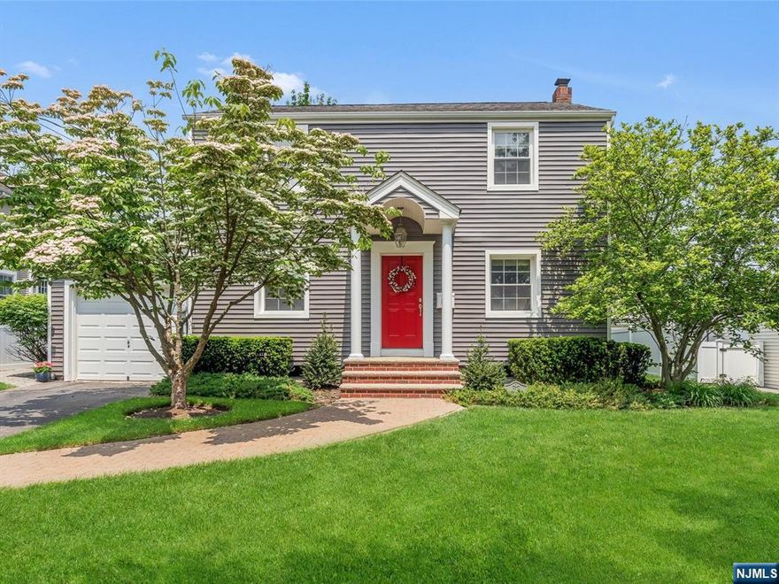 This beautifully appointed & expanded 5 Bedroom, 2.5 Bath Colonial home is situated on a lovely tree lined street in the sought after community of River Edge. Renovated over original & new foundation, this home offers a great flow for entertaining both inside & out. Special features include a formal Living rm w/access to the Family rm w/FPL, which opens to the Chef's Kitchen boasting Cherry cabinetry, granite counters, expansive island w/sink & seating, top of the line Thermador SS appls w/dbl wall oven, 6 burner stove, GE Comm Series refrig & SGD to blue stone patio w/built-in grilling station. Formal Dining rm, FBTH w/walk-in shower & Mud rm w/side door entrance completes this level. Spacious 2nd floor offers 5 generous sized BRs, each w/dbl closets & a FBTHh w/tub & shower. In addition, there's a finished basement w/Family rm, PR, Laundry rm, Utility rm & storage. Also gorgeous hdwd flrs thru-out, 2 Zone Heat & CAC. Desirable RE school system, this home is not to be missed!