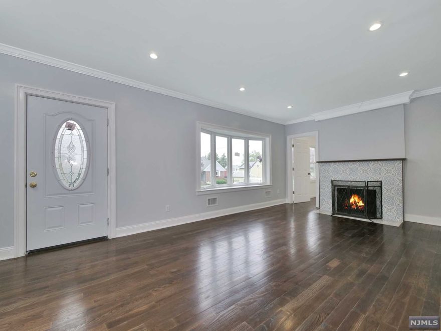 Amazing opportunity to own this Renovated home, great location! Welcome to 79 e 36th st. This beautiful col home sits on a quiet street in a very friendly neighborhood in Paterson on the East side . Walk through the front door to the main level into the spacious living room, open concept beautiful large kitchen with island office and half bath , Make your way to the 2nd level to find 3 bedrooms and 2 bath with a walking closet. finish basement and laundry room,So many things to love about this house including hardwood floors, 2 new HVAC , new retaining wall, new siding and closed to all major highways and shopping. Come visit today, THIS IS A MUST SEE!