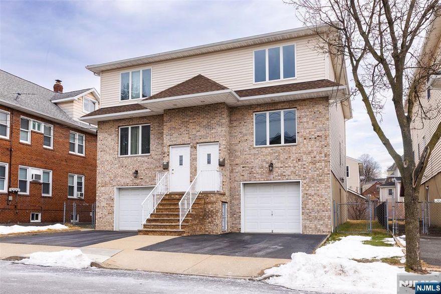 Beautiful duplex apartment. Private entrance, large living room, formal dining room, 1/2 bath, laundry, brand new EIK w/island and sliding glass doors to deck, great for entertaining. Second floor has a primary BR, full bath, 2 additional bedrooms and additional full bath. Hardwood floors throughout. Close to transportation. No pets. No use of garage or driveway. NO SMOKING in unit or on premises. Plenty of town parking. Small storage space in basement for tenant use. Tenant pays all utilities including water.