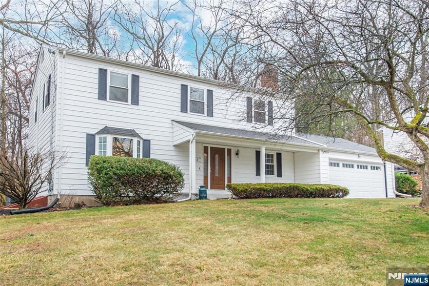 A beautiful home awaits you in Beacon Hill! Offering over 2,200 sqft of living space & an absolutely perfect floorplan. This flowing, classic layout is great for entertaining or everyday living.. Foyer welcomes you in & is bookended by a formal living room & dining room. Both boast large picture windows. Tons of natural light. The kitchen w/ large center island, granite countertops & stainless steel appliances opens to the cozy family room w/ wood burning brick-faced fireplace. Convenient powder room & laundry mudroom offers covered access to the oversized garage. Gorgeous HW flooring. Upstairs 4 generous sized bedrooms & two full baths include a primary suite w/ en-suite & stall shower. Bonus living in the basement w/rec room. Partially unfinished space provides storage along with an attic. Stunning Backyard Oasis- Perfect for Entertaining & Relaxation! A Private Property with a large Deck & built in benches. Walking distance from NYC-Direct train station, shopping & parks. Enjoy bustling Dwtn Denville or choose to visit historic Mt Tabor w/all its colorful homes, post office, library & LIVE events. Top schools. Shows true pride of ownership. Don't miss it!