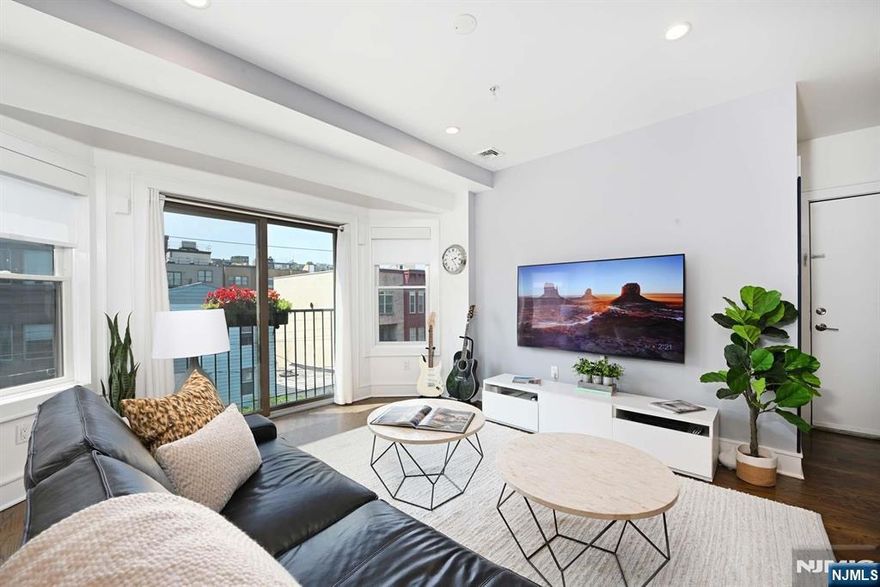 Fantastic layout, beautifully landscaped yard, deeded parking, and elevator building are all delivered in one of Hobokenâ€™s quietest corners. This 2-bedroom, 2-bath condo with a bonus den checks all the boxes for modern urban living. With 8.5-foot ceilings, a sun-soaked open layout, and a Juliette balcony, this spacious home is bright, airy, and welcoming from the moment you walk in. The renovated kitchen features white quartz countertops, custom cabinetry with rollout pantries, a vented gas range, and stainless steel appliances. An LG washer and dryer are tucked away in a dedicated laundry closet, and smart upgrades like a Nest thermostat and custom blinds were installed offering comfort and convenience. The den adds flexible space for a home office, nursery, or guest room. The primary updated bathroom , offers clean, timeless finishes. Every inch of the home has been thoughtfully updated and beautifully maintainedâ€”truly move-in ready. The deeded parking spot is one of the best in the building and comes with two large, private storage cabinets directly in front. The professionally landscaped shared backyard offers a peaceful outdoor escape. With a low HOA that covers building insurance, landscaping, water, snow removal, and more, this home offers both value and ease. Located just steps from the Jackson Street Park, a short walk to Washington street, near an up coming new supermarket, all major transportation and minutes from the Holland Tunnel, this is the Hoboken lifesty