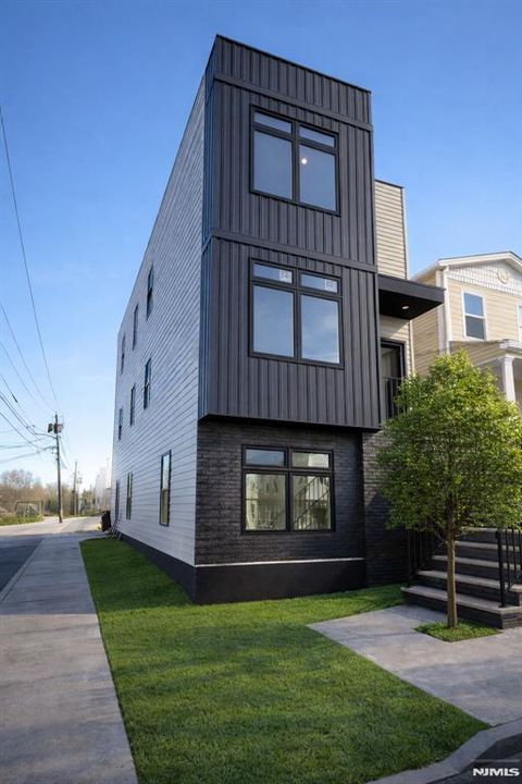 Photo of 57 Rosa Parks Blvd, Paterson, NJ 07524 (MLS # 25043583)