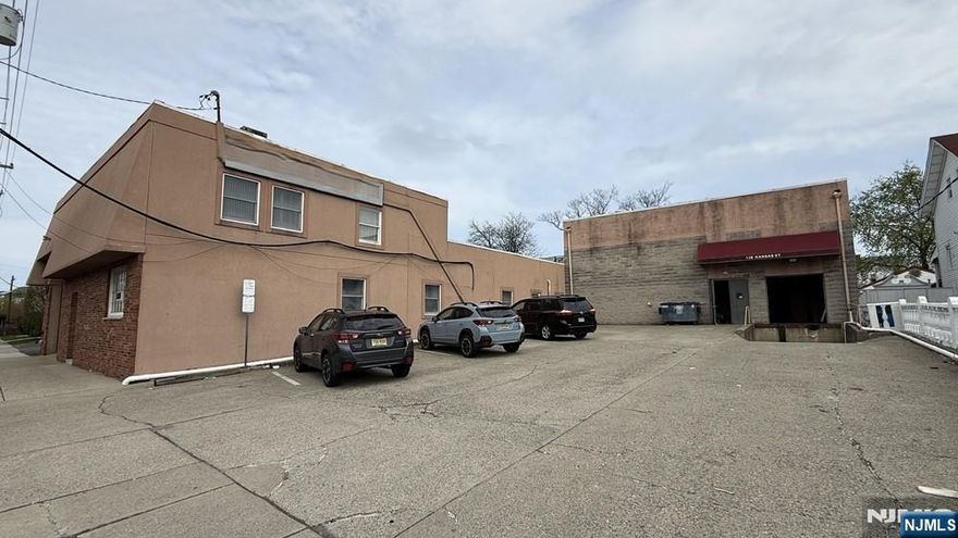 Prime Industrial Opportunity in Hackensack. Discover 15,000 SF of pristine, versatile warehouse space situated in a premier Hackensack location. This well-appointed facility features 11,400 SF of high-bay warehouse space with impressive 18â€™â€“20â€™ clearances, complemented by 3,600 SF of professional office space (8â€™â€“9â€™ ceilings). Functional highlights include a full loading dock and dedicated parking for 9 vehicles. Offered at $16/SF NNN (plus $5.50 for taxes, insurance, and CAM), this property provides seamless access to major highways, retail centers, and local amenities. The premises are offered in as-is condition.