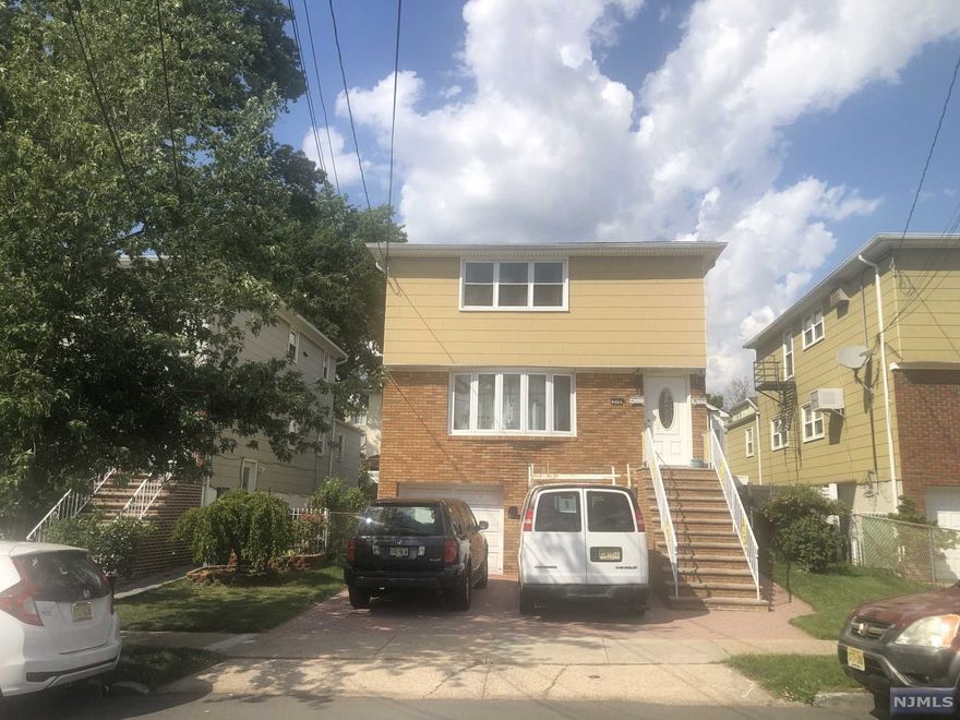 2 Family Home in very good condition with finished basement. 1st Floor-3 Bedrooms, Living Room, Kitchen, 1 Bath. 2nd Floor-2 Bedrooms, Living Room, Kitchen, 1 Bath. 2 car garage. 1 heating Unit